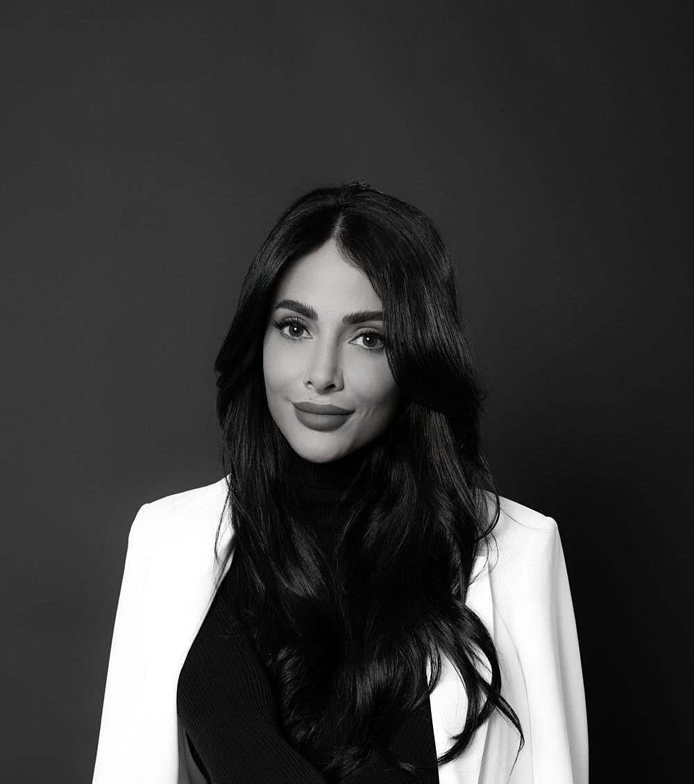 Black-and-white portrait of Sep Ashkani, cosmetic tattoo artist